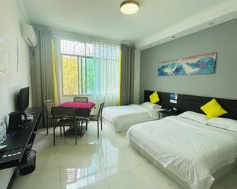 Xian Lai Ke Hostel - Qiannan - Bedroom