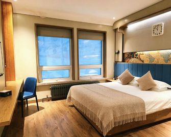 Harbin Rujing Shipping River View Hotel (Zhonghua Baroque Street Metro Station Branch) - Harbin - Habitación