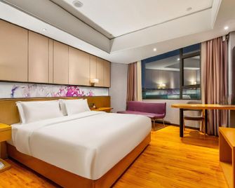 Enjoy Hotels (Guangzhou Sanyuanli Metro Station) - Guangzhou - Bedroom