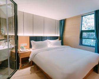 Qingmu Hotel Ma'anshan Central Garden - Ma'anshan - Slaapkamer