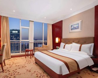 Tianjin Huigao Garden Hotel - Tianjin - Slaapkamer