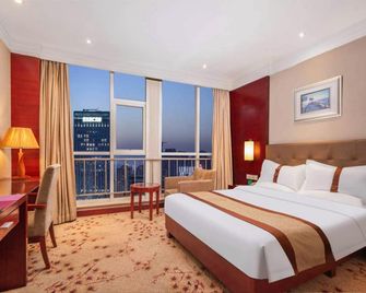 هويجاو جاردن هوتل - تيانجين - غرفة نوم