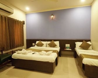 hotel pride inn - Shirdi - Ložnice