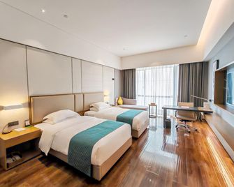 Rezen Longuu Hotel Maoming Xinyi Education City - Maoming - Habitación