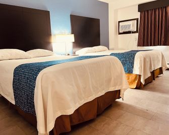 Travelodge by Wyndham Valleyfair Shakopee - Shakopee - Schlafzimmer