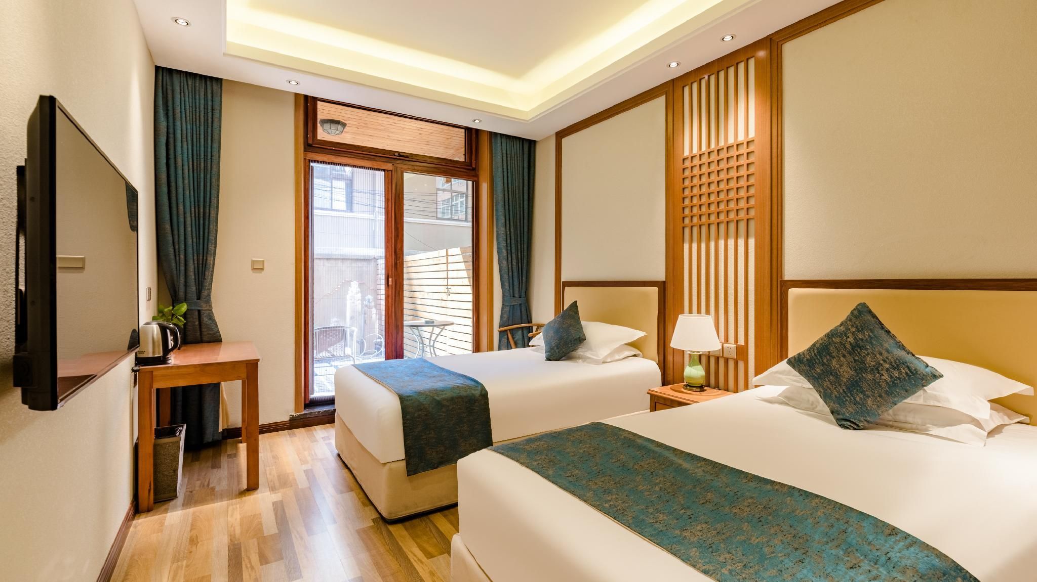 Floral Hotel Amber's - تشينغداو - غرفة نوم