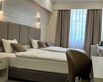 جراند أوتيل أوراسيا - ألماتي - غرفة نوم