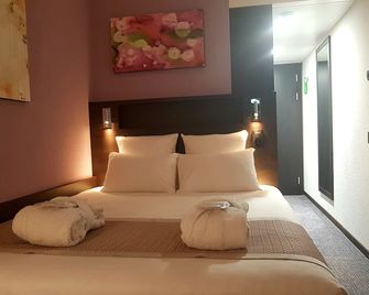 Nash Pratik Hotel - Meyrin - Schlafzimmer