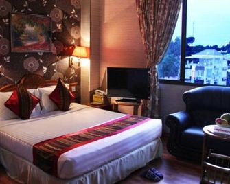 إكسيل تريشار هوتل - يانغون - غرفة نوم