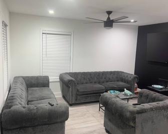 A stylish Ranch Style centrally-located home. Get some R&R it’s on Us - East Point - Living room