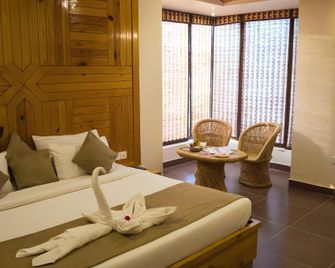 The Roar Resort - Rāmnagar - Bedroom