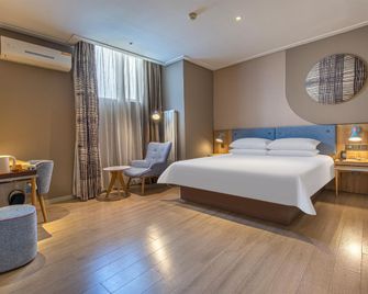 Home Inn Neo Jinan Jingshi Road Hexie Plaza - Jinan - Camera da letto