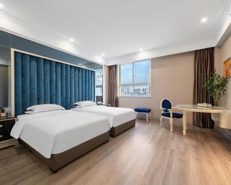 Archos Boutique Hotel - Ankang - Bedroom