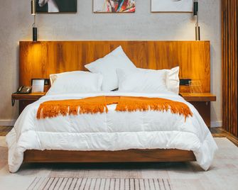 Burundi Palace Boutique Hotel - Bujumbura - Sovrum