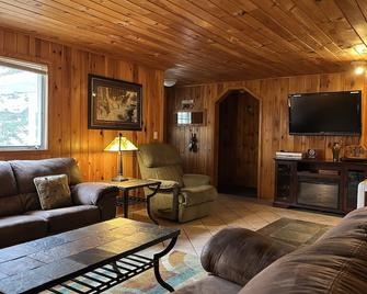 Hot tub!.skiing, snowmobiling, fishing, canoeing, swimming, hiking, Wellston Mi. - Wellston - Living room
