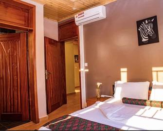 Konga Guesthouse - Кігалі - Спальня