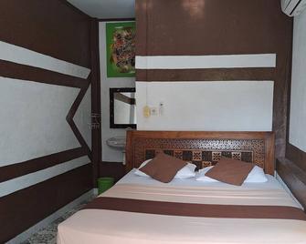 Cozy Alfia Inn - Pemenang - Yatak Odası
