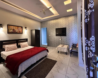 Hotel Tulsi Inn - Халдвані - Спальня