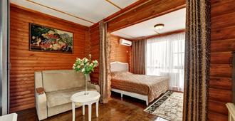 Hotel Hutorok - וולגוגראד - חדר שינה