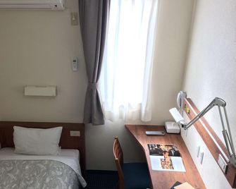 @ Business Hotel Ichinoseki - Ichinoseki - Bedroom
