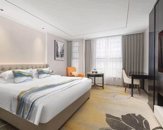 Zhenbao Holiday Hotel (Nanjing Olympic Sports Center) - Nankín - Habitación
