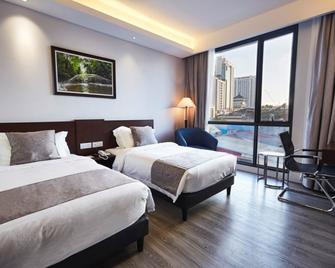 Meritin Hotel - קוצ'ינג - חדר שינה