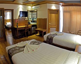 هوتل سيدني - يانغون - غرفة نوم