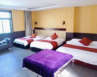 Xuancheng Jingxian Hehuatang Business Inn - Xuancheng - Habitación