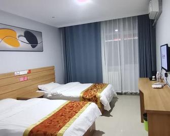 Junyi Hotel Shandong Zaozhuang Shanting District Xinyuan Road - Zaozhuang - Bedroom