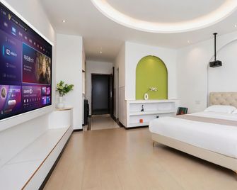 Yunlang Xinghe Designer Hotel (Dezhou Aodele Times Square Branch) - Dezhou - Спальня