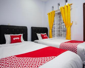 Hotel O Sopou Penginapan Rinal & Tuah - Pematangsiantar - Habitación