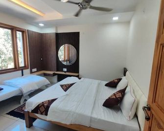 Hotel Greenland Inn Hampi - Hampi - Ložnice