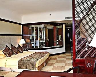 Wonderport International Hotel - Lijiang - Bedroom