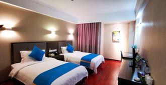 Chizhou Yinxing Business Hotel - Chizhou - Bedroom