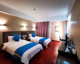 Chizhou Yinxing Business Hotel - Chizhou - Bedroom