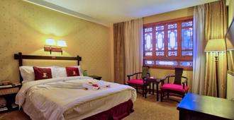Lijiang Wangfu Hotel - ליז'יאנג - חדר שינה