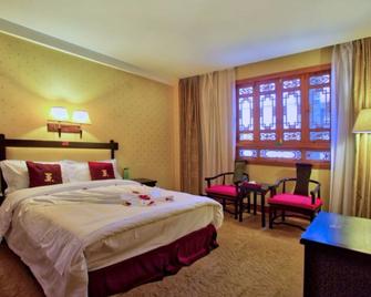 Lijiang Wangfu Hotel - ליז'יאנג - חדר שינה