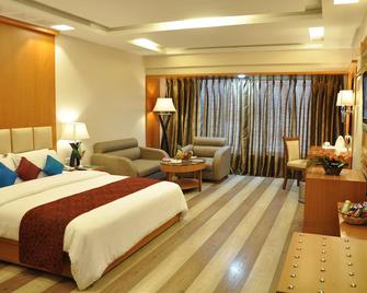 Hotel Babylon Inn - Raipur - Schlafzimmer