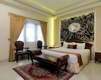 Hotel Indah Palace Yogyakarta - Yogyakarta - Bedroom