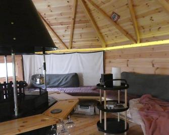 We have 2 rooms to offer at our home - there is a very large downstairs bedroom with ensuite OR a beautiful bar b q lodge with 4 sleeping platforms with its own separate toilet and shower facility opposite the lodge - please book the room you want - Portishead - Living room