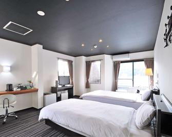 Tsuyama Grand Hotel - Tsuyama - Ložnice