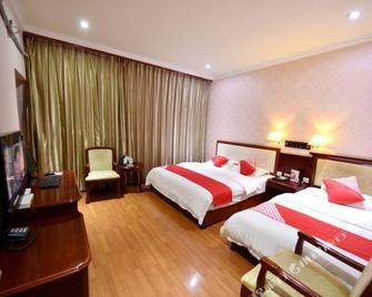 Ya'an Caiyuan Business Hotel - Ya'an - Bedroom