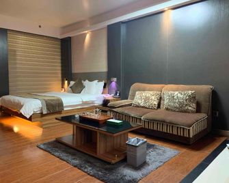 Dongying Oasis Impression Boutique Hotel - Dongying - Bedroom