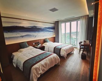 Oriental Landscape Holiday Hotel - צ'ונגקינג - חדר שינה