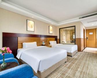 Qingdao Airport Fuhua Hotel (Hong Kong Middle Road) - Qingdao - Schlafzimmer