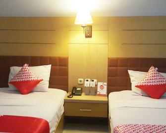 OYO 1088 Hotel Mega Sentosa - Samarinda - Yatak Odası