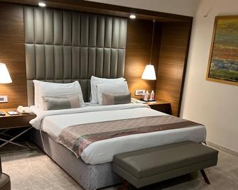 Rivera Sarovar Portico Ahmedabad - אחמדאבאד - חדר שינה