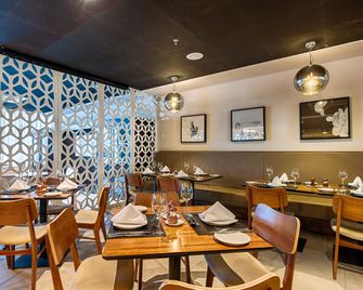 Holiday Inn Belo Horizonte Savassi by IHG - Belo Horizonte - Restaurant
