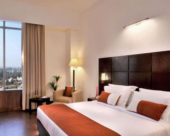 Comfort Inn Tulip Heights - Bathinda - Bedroom