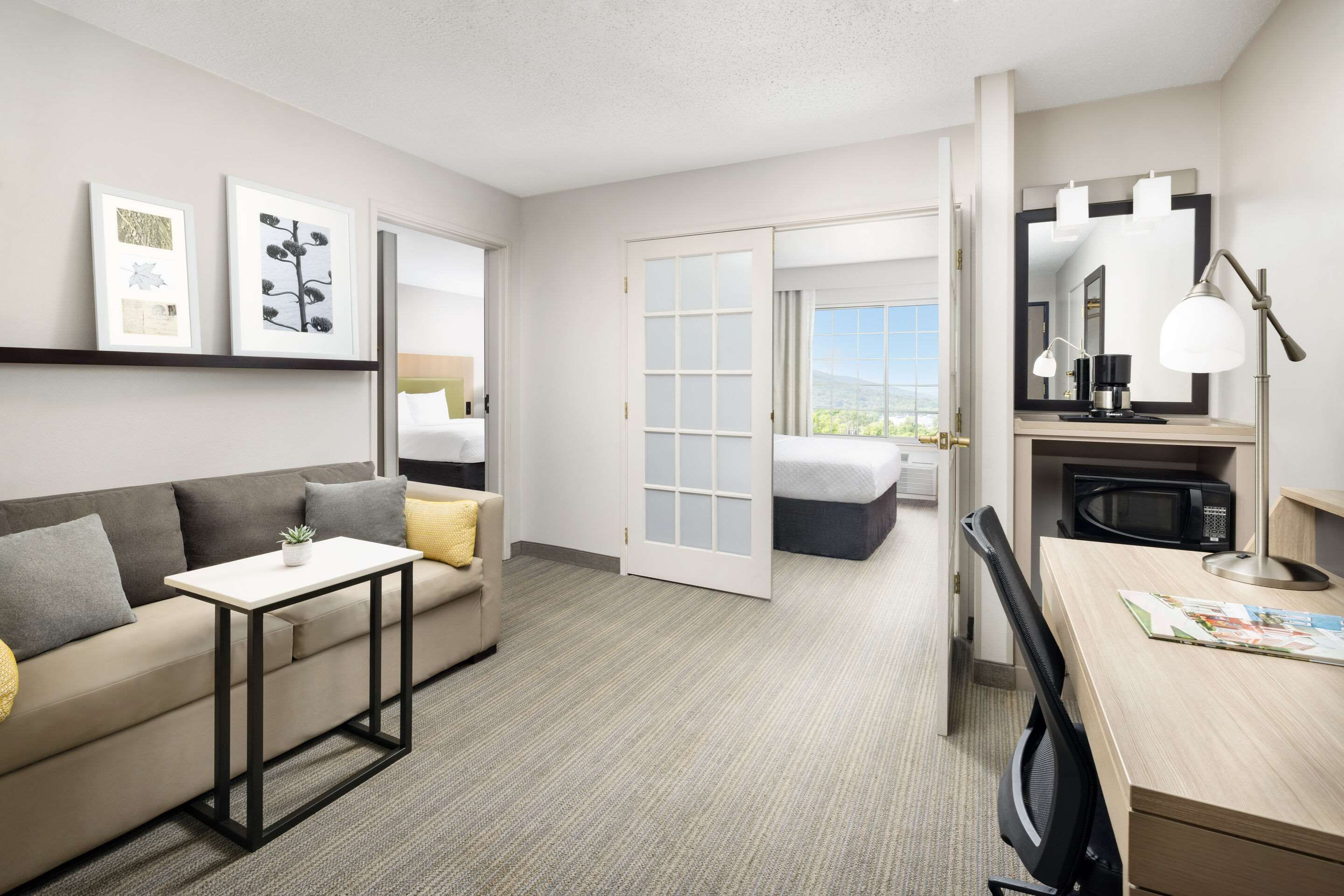 Living room view of Country Inn & Suites by Radisson, Big Flats, NY